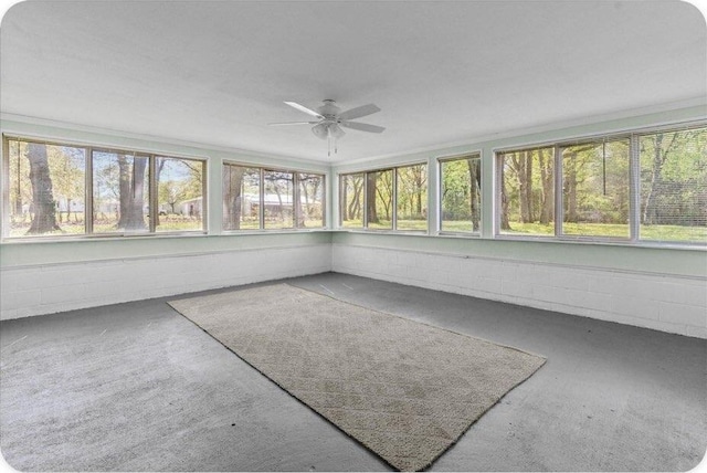 433 Old Aurora Rd, Verona, MO 65769 - unfurnished sunroom featuring concrete block wall and carpet flooring