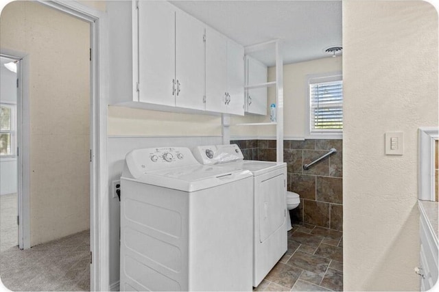 433 Old Aurora Rd, Verona, MO 65769 - laundry room with washing machine and dryer and tile walls