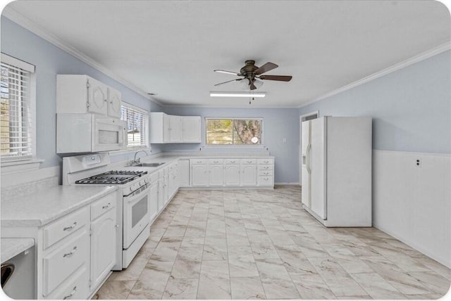 433 Old Aurora Rd, Verona, MO 65769 - kitchen featuring white appliances, crown molding, a ceiling fan, white cabinets, and light countertops