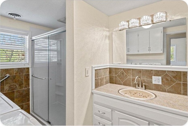 433 Old Aurora Rd, Verona, MO 65769 - bathroom featuring a shower stall, vanity, decorative backsplash, and a textured wall