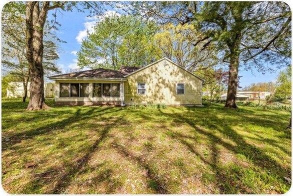 433 Old Aurora Rd, Verona, MO 65769 - back of house featuring a lawn