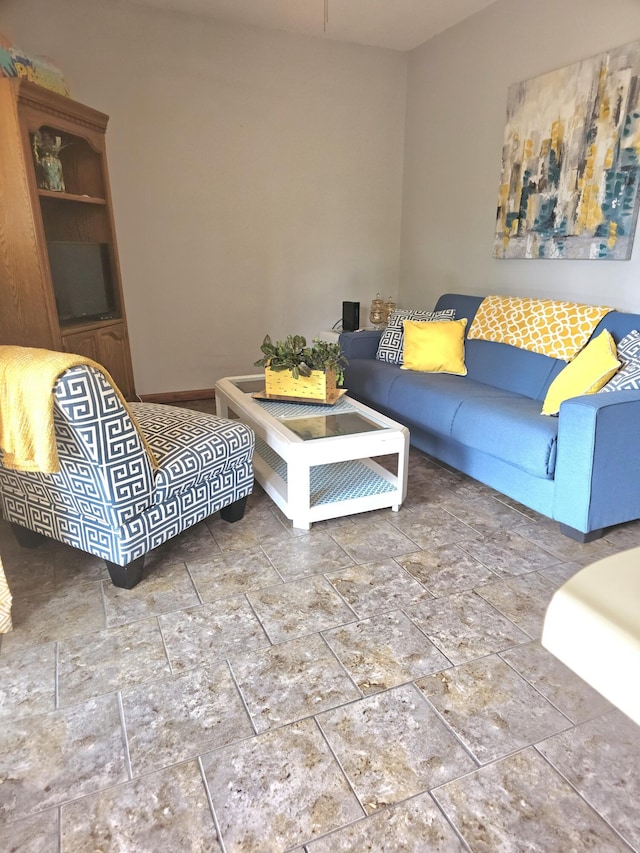 388 Notch Ln Bldg 5 Unit B, Branson West, MO 65737 - living area featuring stone finish floors and baseboards