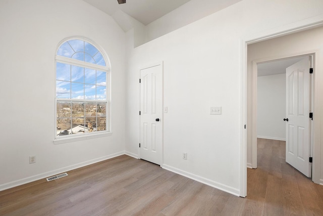 903 N 4th St, Ozark, MO 65721 - unfurnished bedroom featuring light wood finished floors and lofted ceiling