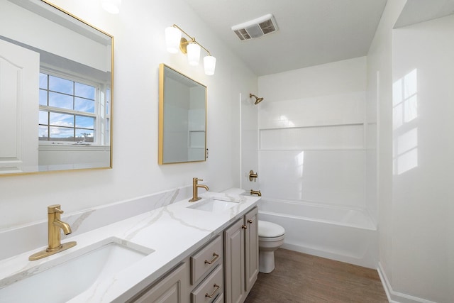 903 N 4th St, Ozark, MO 65721 - full bath featuring double vanity, wood finished floors, and shower / tub combination