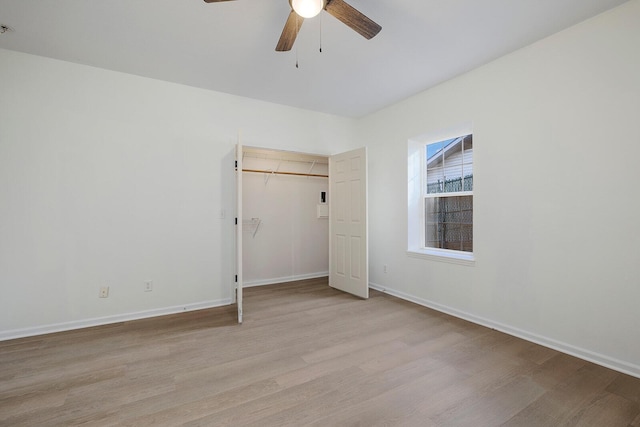 903 N 4th St, Ozark, MO 65721 - unfurnished bedroom with light wood-style floors, a closet, and a ceiling fan