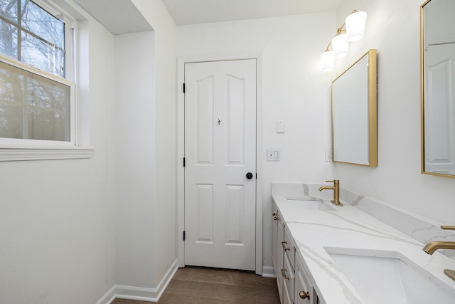 903 N 4th St, Ozark, MO 65721 - bathroom featuring double vanity and wood finished floors