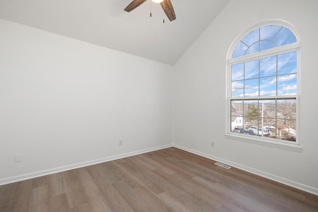 903 N 4th St, Ozark, MO 65721 - spare room with a ceiling fan, wood finished floors, and vaulted ceiling