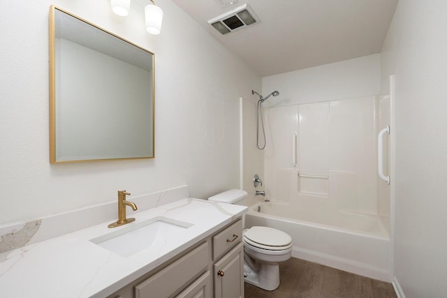 903 N 4th St, Ozark, MO 65721 - bathroom with vanity, tub / shower combination, and wood finished floors