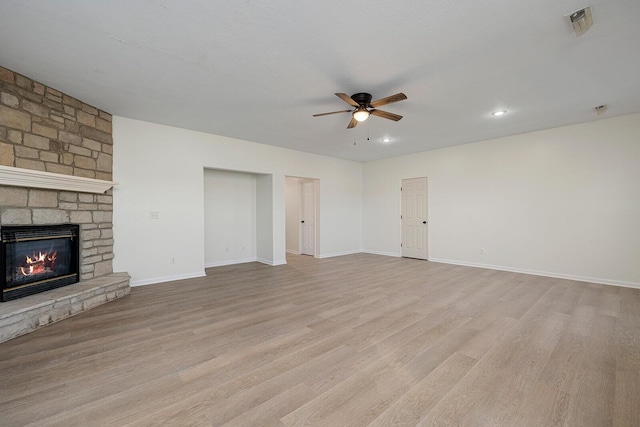 903 N 4th St, Ozark, MO 65721 - unfurnished living room with ceiling fan, a fireplace, light wood finished floors, and recessed lighting