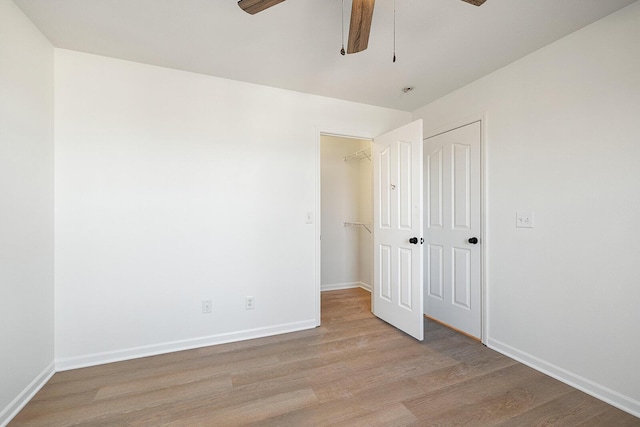 903 N 4th St, Ozark, MO 65721 - unfurnished bedroom with wood finished floors, a closet, and ceiling fan