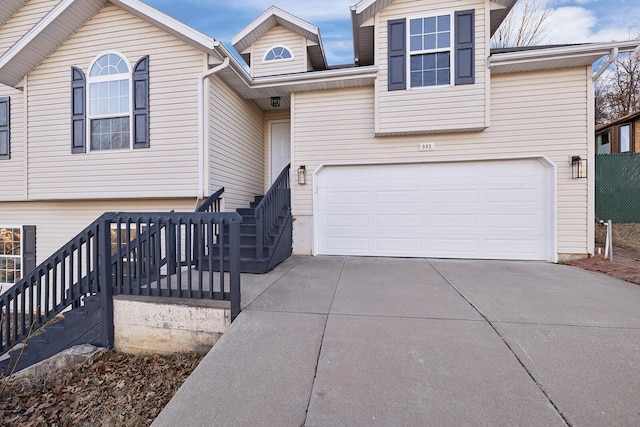 903 N 4th St, Ozark, MO 65721 - view of front of property with driveway, a garage, and stairs