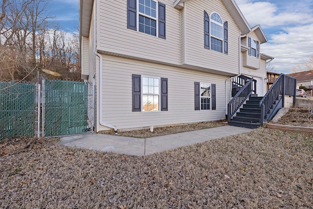 903 N 4th St, Ozark, MO 65721 - back of property featuring stairs and a gate