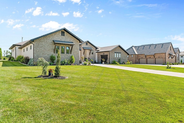 3972 E Dunrobin Dr, Springfield, MO 65809 - view of front facade featuring concrete driveway, a front yard, a garage, and stone siding