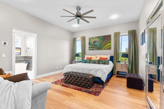 3972 E Dunrobin Dr, Springfield, MO 65809 - bedroom with multiple windows, light wood finished floors, recessed lighting, a ceiling fan, and connected bathroom