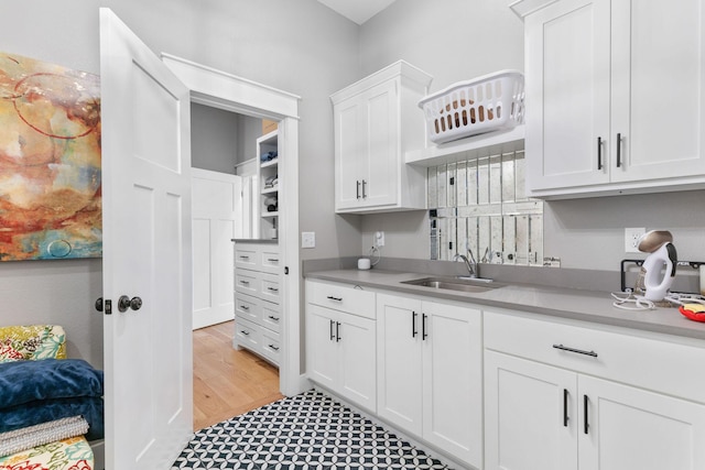 3972 E Dunrobin Dr, Springfield, MO 65809 - kitchen featuring light countertops, white cabinetry, and light floors