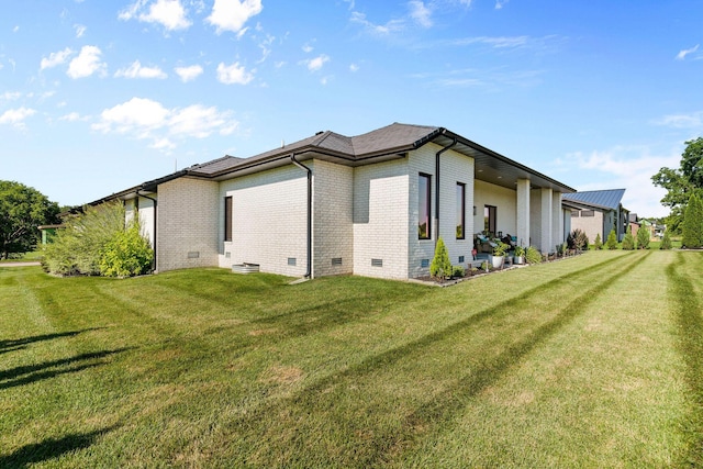3972 E Dunrobin Dr, Springfield, MO 65809 - view of home's exterior featuring crawl space, brick siding, and a lawn