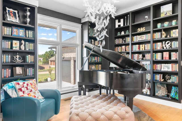 3972 E Dunrobin Dr, Springfield, MO 65809 - sitting room featuring wood finished floors and a chandelier
