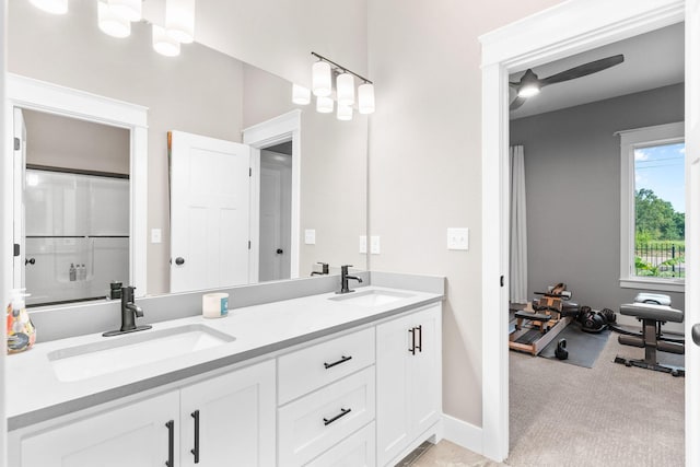 3972 E Dunrobin Dr, Springfield, MO 65809 - bathroom featuring double vanity and baseboards