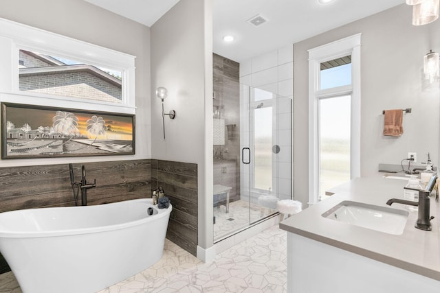3972 E Dunrobin Dr, Springfield, MO 65809 - bathroom featuring a shower stall, a freestanding tub, vanity, and recessed lighting