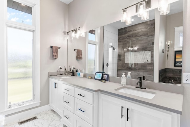 3972 E Dunrobin Dr, Springfield, MO 65809 - full bath featuring double vanity, marble finish flooring, a stall shower, and plenty of natural light