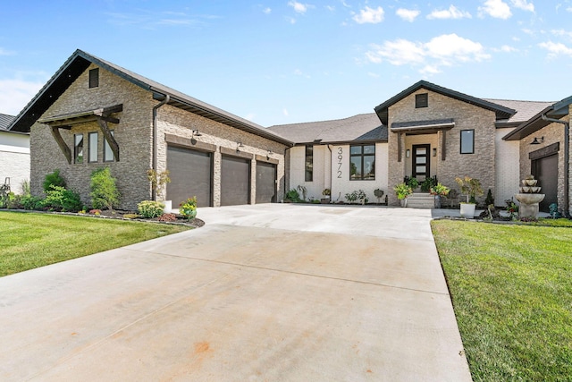 3972 E Dunrobin Dr, Springfield, MO 65809 - view of front of house featuring driveway, a front lawn, brick siding, and a garage