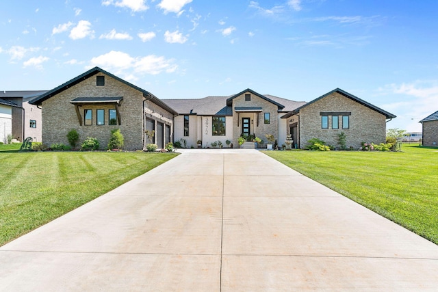 3972 E Dunrobin Dr, Springfield, MO 65809 - view of front of house with concrete driveway, an attached garage, a front lawn, and brick siding