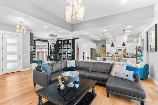 3972 E Dunrobin Dr, Springfield, MO 65809 - living room featuring a chandelier, light wood-style floors, and recessed lighting