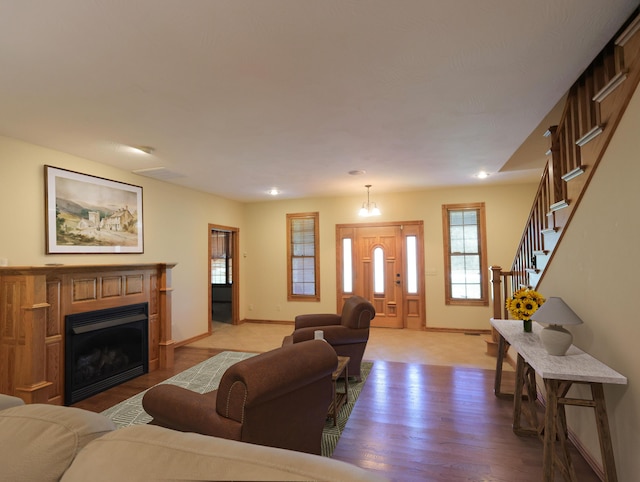 6092 W Farm Rd Unit 114, Springfield, MO 65802 - living area featuring light wood finished floors, a fireplace, stairs, and recessed lighting