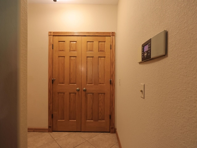 6092 W Farm Rd Unit 114, Springfield, MO 65802 - hall featuring light tile patterned floors