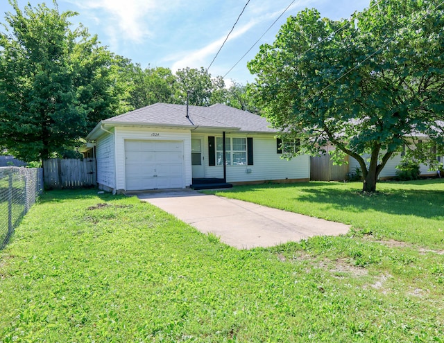 1324 N Forest Ave, Springfield, MO 65802 - single story home with an attached garage and concrete driveway