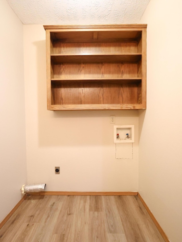 1324 N Forest Ave, Springfield, MO 65802 - washroom with electric dryer hookup, wood finished floors, washer hookup, and a textured ceiling