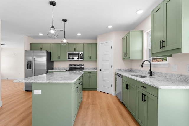 265 Mccann Rd, Powersite, MO 65731 - kitchen with appliances with stainless steel finishes, green cabinets, a center island, and recessed lighting