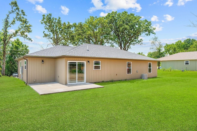 265 Mccann Rd, Powersite, MO 65731 - rear view of property featuring a patio, a lawn, and a shingled roof