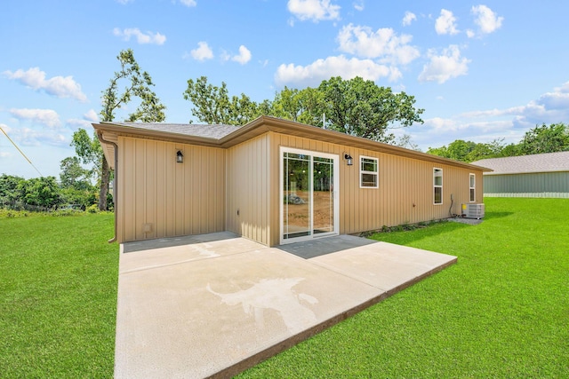 265 Mccann Rd, Powersite, MO 65731 - back of property featuring a patio area and a lawn