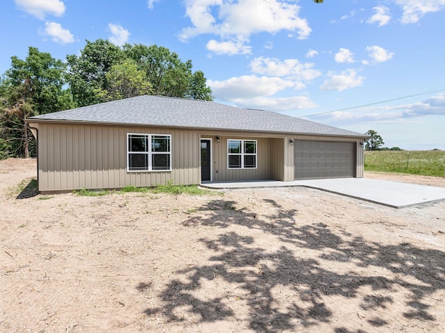 265 Mccann Rd, Powersite, MO 65731 - view of front of property with an attached garage, roof with shingles, and concrete driveway