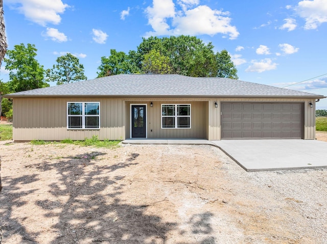 265 Mccann Rd, Powersite, MO 65731 - ranch-style house with concrete driveway, an attached garage, a shingled roof, and a porch