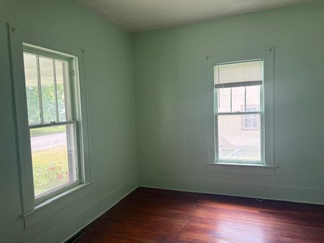714 W Leyda Ave, West Plains, MO 65775 - unfurnished room featuring healthy amount of natural light and dark wood-style floors