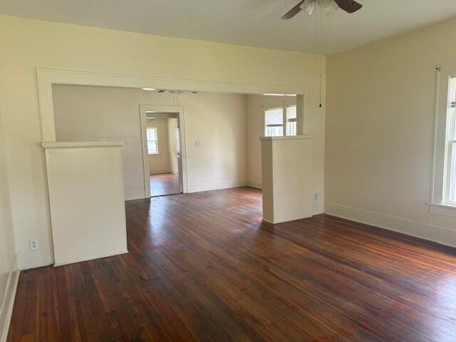 714 W Leyda Ave, West Plains, MO 65775 - unfurnished room featuring dark wood-style flooring, ceiling fan, and plenty of natural light