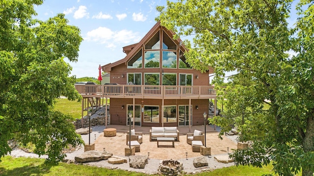 78 Free Bird Ln, Reeds Spring, MO 65737 - back of house with stairway, a deck, a patio area, and an outdoor living space with a fire pit