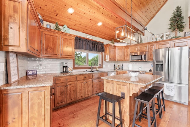 78 Free Bird Ln, Reeds Spring, MO 65737 - kitchen with stainless steel appliances, wooden ceiling, light wood-type flooring, a kitchen breakfast bar, and recessed lighting