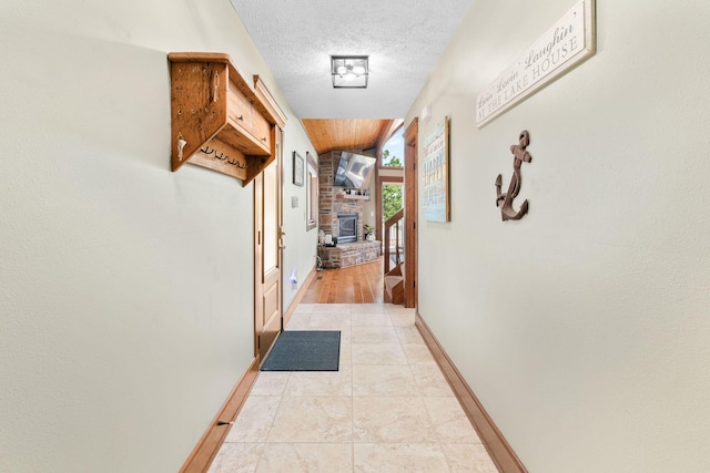 78 Free Bird Ln, Reeds Spring, MO 65737 - hall with a textured ceiling and vaulted ceiling
