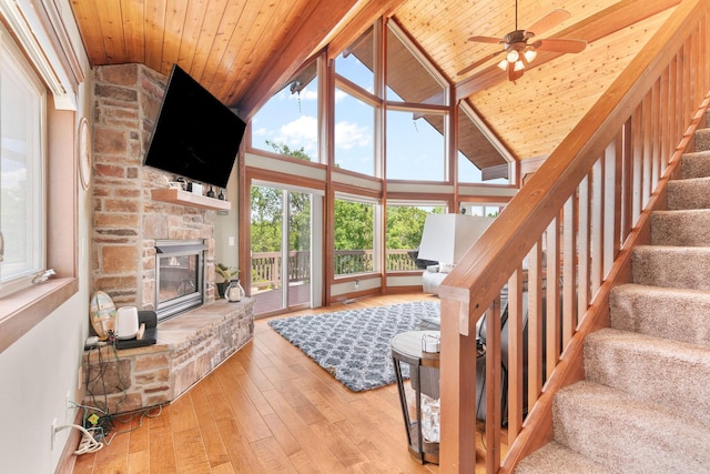 78 Free Bird Ln, Reeds Spring, MO 65737 - living area with wooden ceiling, hardwood / wood-style floors, a stone fireplace, stairway, and a ceiling fan