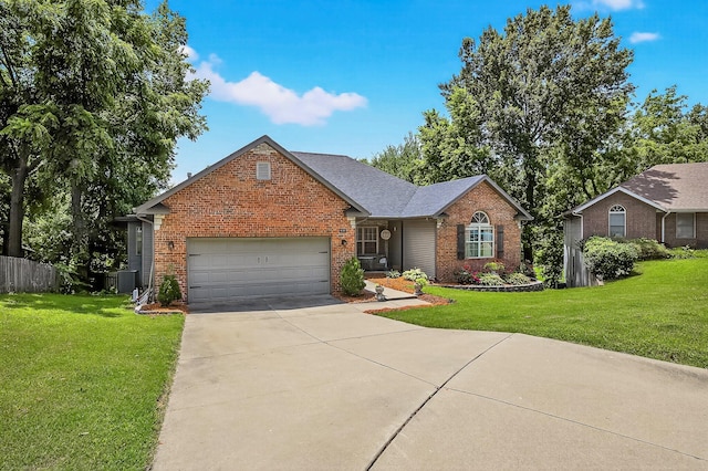 4050 W Page Pl, Springfield, MO 65802 - traditional-style house with brick siding, a garage, and concrete driveway
