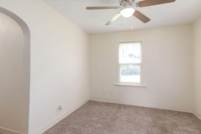 1921 W Atlantic St, Springfield, MO 65803 - unfurnished room featuring arched walkways, light colored carpet, and ceiling fan