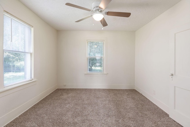 1921 W Atlantic St, Springfield, MO 65803 - spare room with a textured ceiling, light carpet, and a ceiling fan