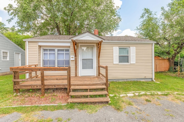 1921 W Atlantic St, Springfield, MO 65803 - bungalow-style home featuring a chimney, a wooden deck, and a shingled roof