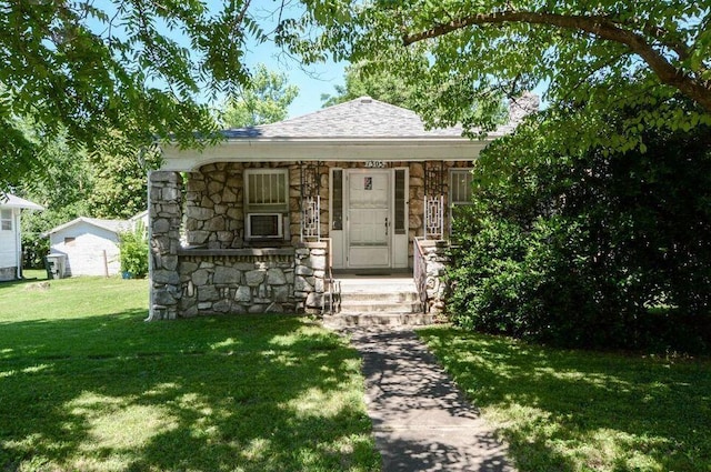 1305 S Kimbrough Ave, Springfield, MO 65807 - bungalow-style house with stone siding, a front lawn, and roof with shingles