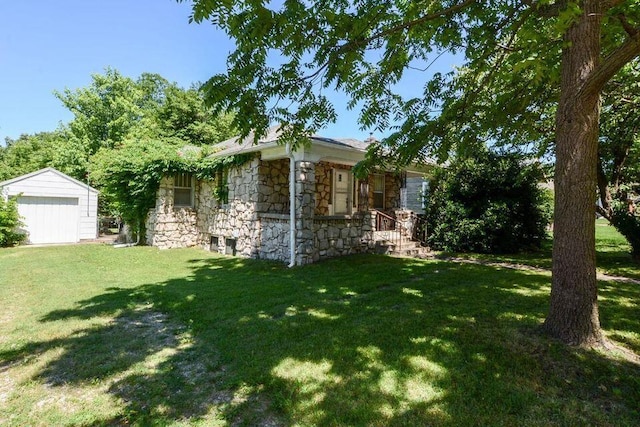 1305 S Kimbrough Ave, Springfield, MO 65807 - view of home's exterior with stone siding, a yard, a garage, and an outdoor structure