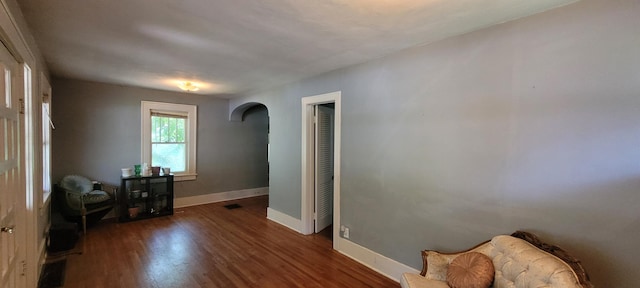 1305 S Kimbrough Ave, Springfield, MO 65807 - living area with arched walkways and wood finished floors