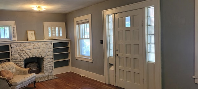 1305 S Kimbrough Ave, Springfield, MO 65807 - entryway featuring dark wood-style floors and a fireplace